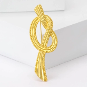 Elegant vintage gold twisted knot brooch with textured rope finish for women dresses