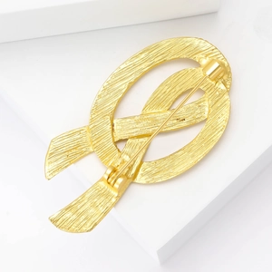 Vintage French style brushed gold bow brooch with secure pin closure mechanism