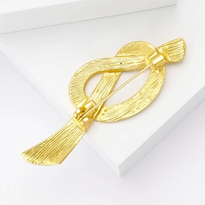 French vintage matte gold knot brooch with textured finish and secure pin back
