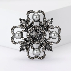 Baroque crystal flower brooch with grey gemstones and pearls in gunmetal finish
