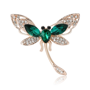 Elegant gold-plated dragonfly brooch with green emerald-cut stones and sparkling crystals
