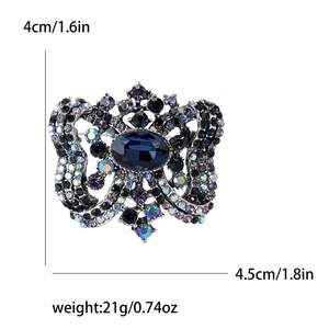 Vintage butterfly brooch with blue crystal and purple rhinestones, 4.5cm wide design