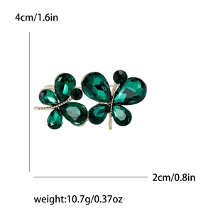 Broche papillon élégante en strass verts et placage or mesurant 4cm sur 2cm
