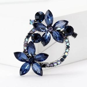 Sparkling crystal flower wreath brooch with blue and iridescent rhinestones on silver base