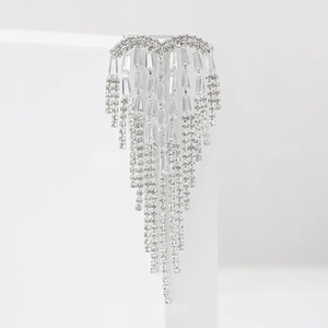 Detail of silver alloy brooch featuring sparkling cubic zirconia and long tassel chains