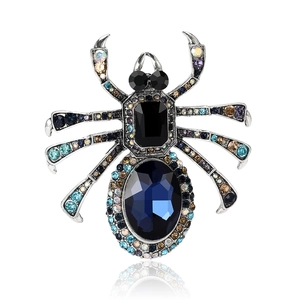 Broche araignée vintage en argent antique sertie de strass colorés et de pierres bleues