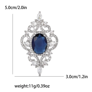 Broche de style vintage avec saphir bleu et pierres de zircone cubique transparentes