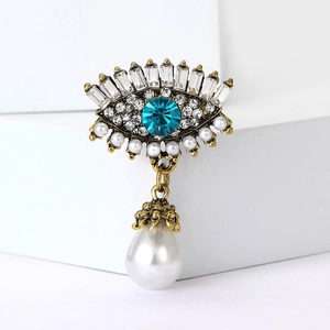 Broche luxueuse œil de protection avec strass bleu et pendentif perle pour vêtements