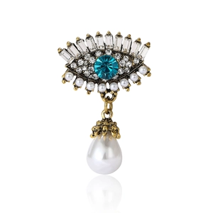 Broche luxueuse œil protecteur avec cristal bleu, strass et pendentif en perle