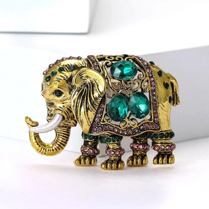 Vintage olifant broche met smaragdgroene kristallen en goud plating voor kostuums