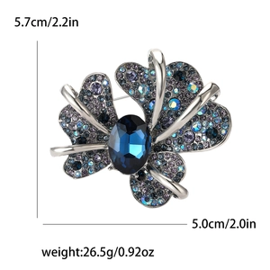 Detailed iris brooch size guide with blue rhinestones measuring 5.7cm by 5.0cm