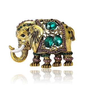 Exotische olifantenspeld met groene strasstenen en vergulde vintage metalen afwerking