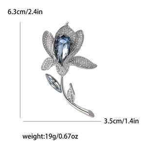 Detailed view of lily brooch with blue crystal, size 6.3x3.5cm and weight 19g