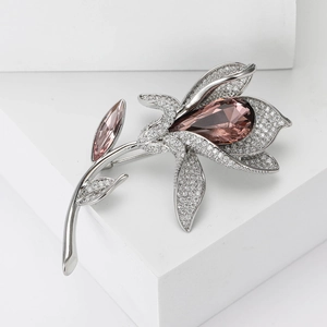 Elegant lily flower brooch with pink teardrop crystal and sparkling silver zircons