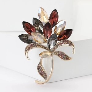 Elegant vintage gold alloy bouquet brooch with amber crystals and rhinestones