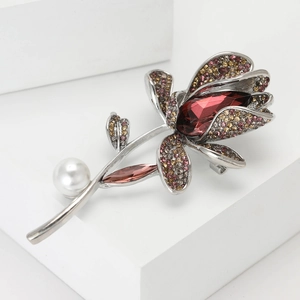 Elegant orchid brooch with red gemstone, pink rhinestones and a white pearl accent
