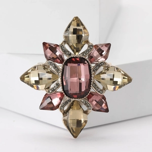 Vintage starburst brooch with burgundy crystals and rhinestones on gold alloy base