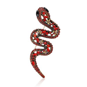 Broche serpent exquise en or vintage avec strass rouges et yeux en pierres noires sur fond
