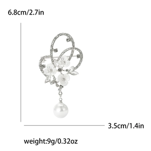 Détails des dimensions de la broche fleur papillon avec émail blanc et perle