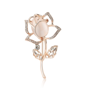 Elegant rose gold tulip brooch with pink cat eye stone and sparkling crystals on white background