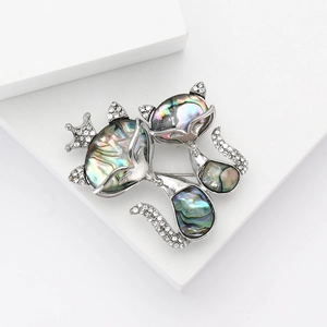 Vintage alloy cat brooch with iridescent abalone shell inlay and sparkling rhinestones