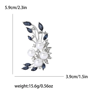 Elegant floral brooch with pearls and blue rhinestones on silver base, 5.9cm height