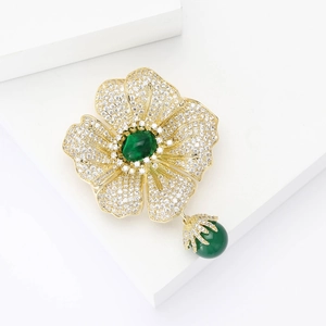 Elegant begonia flower brooch with zircon paving and green pearl drop in gold finish