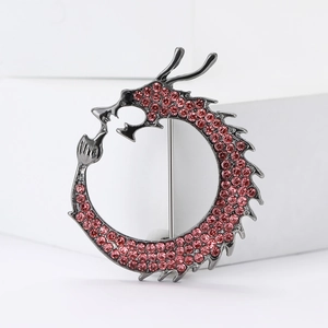 Chinese dragon brooch in gun-black alloy with red rhinestones in an Ouroboros circle