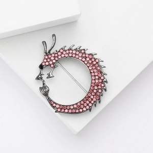 Chinese dragon brooch in gunmetal alloy with pink rhinestones and safety pin clasp