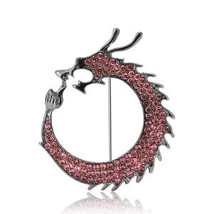 Silver dragon brooch with sparkling pink rhinestones and a biting tail design