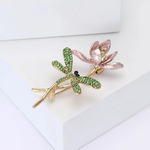 Elegant dragonfly and lotus brooch with green micro-inlay and pink enamel in gold plating