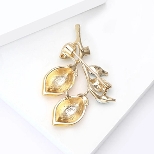 Golden alloy enamel double lemon brooch with secure safety pin clasp on back view
