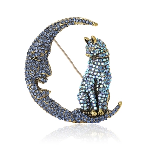 Fashionable moon cat brooch featuring vintage gold alloy and sparkling blue rhinestones