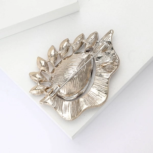 Detailed back view of silver alloy brooch with secure safety pin clasp and textured finish