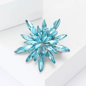 Elegant rhinestone star brooch with marquise-cut light blue crystals on silver base