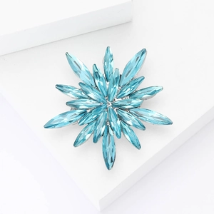 Exquisite starburst brooch with light blue marquise crystals on a silver alloy base