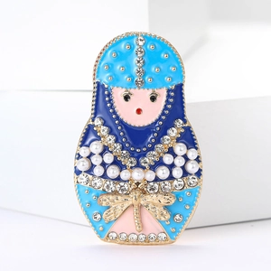 Detail of blue enamel Russian doll brooch with pearls, rhinestones and golden dragonfly