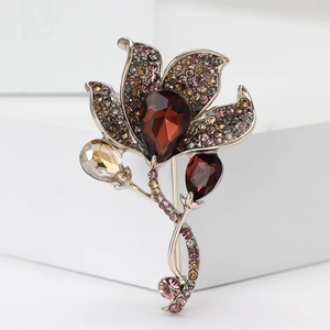 Elegant Calla Lily flower brooch with vintage crystals and a deep red teardrop stone