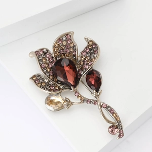 Elegant Calla Lily flower brooch with sparkling rhinestones and brown gems on white background