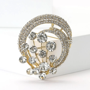 Macro shot of gold-plated hot air balloon brooch with sparkling rhinestones and crystals