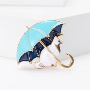 Detail of creative alloy cat and blue umbrella brooch with colorful enamel finish