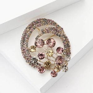 Elegant hot air balloon inspired gold brooch with pavé rhinestones and multi-colored gems