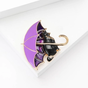 Charming enamel black cat and purple umbrella brooch pin in a gold-plated alloy finish