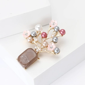 Broche arbre en fleurs de prunier dorée avec perles colorées et pierre marbrée