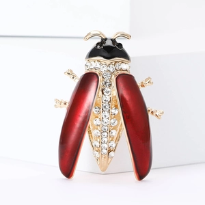 Elegant gold-plated ladybug brooch with red enamel and sparkling crystal inlay