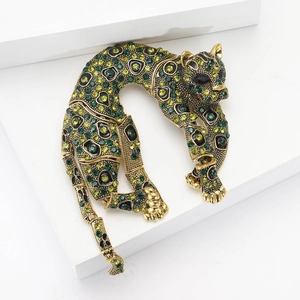 Luxury leopard brooch in gold-plated alloy with green rhinestones for elegant formal wear