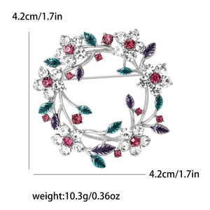 Detail view showing 4.2cm diameter of silver crystal floral wreath brooch with rhinestones