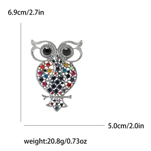 Detail view of the colorful rhinestone owl brooch showing size dimensions 6.9cm and 5.0cm