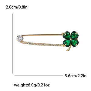 Golden clover safety pin brooch with green heart crystals and small white rhinestones