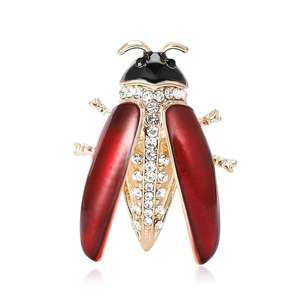 Elegant gold-plated enamel ladybug brooch with sparkling rhinestones on white background